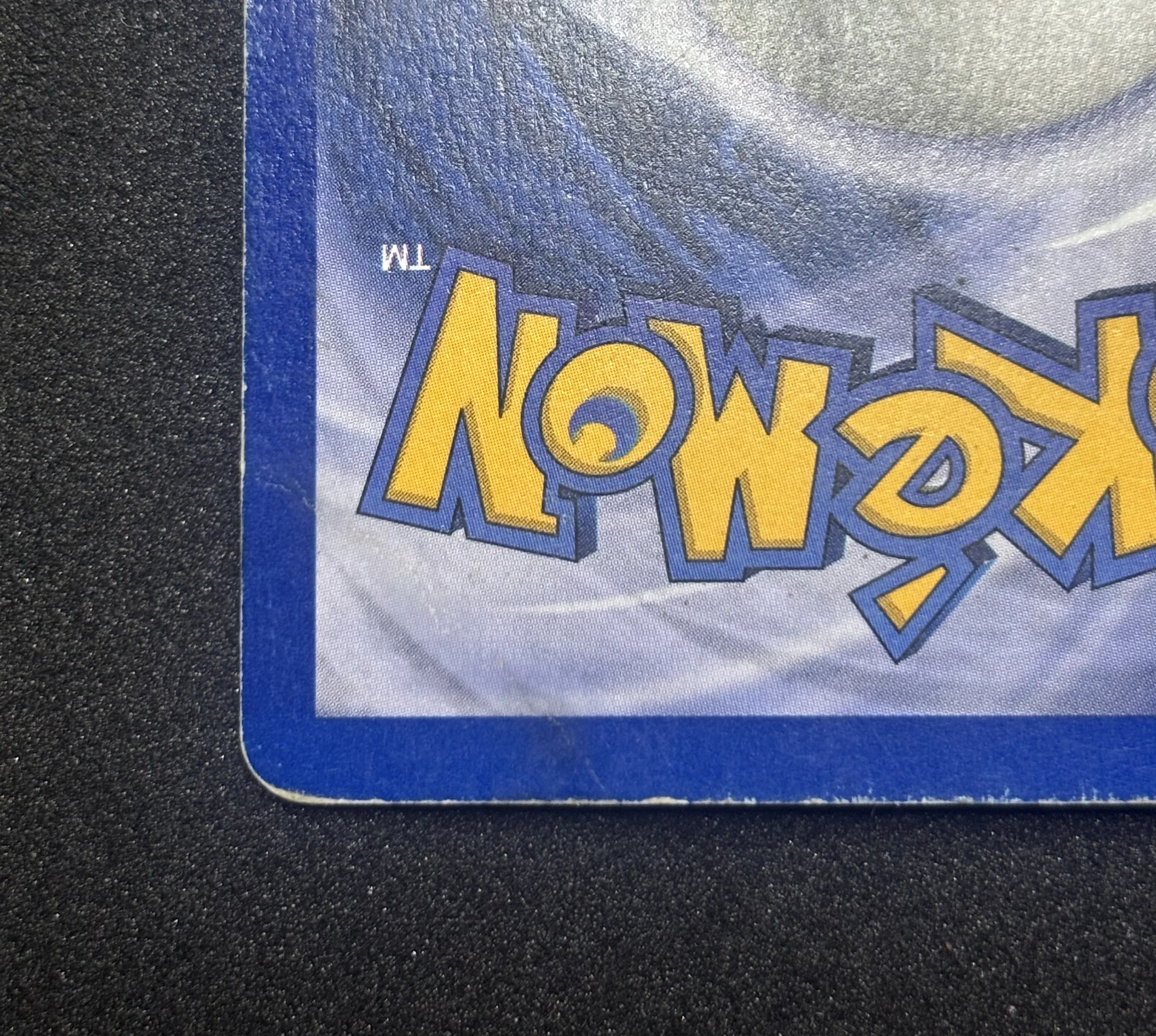 Pokemon card after restoration - crease removed, clean edges